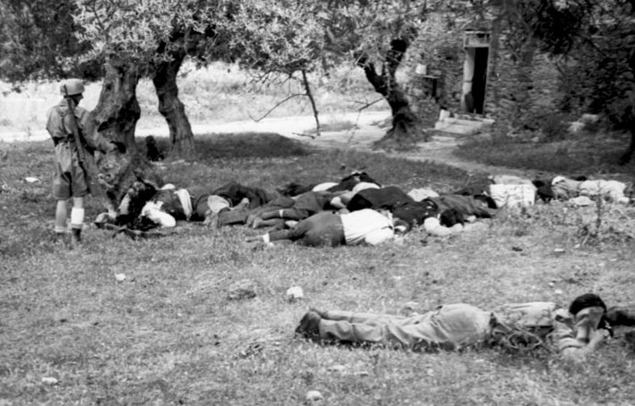 Greek civilians lying dead in an olive orchard